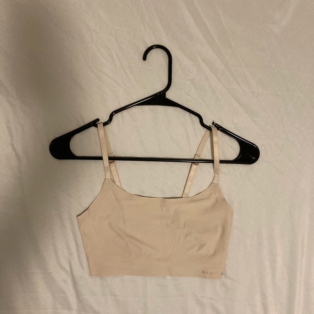 It is a cream sport bra size small